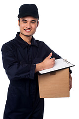 Image showing Smiling delivery man at your doorstep