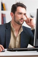 Image showing Man Looking At A Computer Monitor