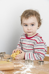 Image showing young child making cookies