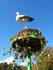 Image showing people made artifisial nest of storks