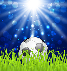 Image showing Soccer ball on green grass with shine effect 