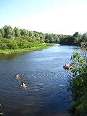 Image showing beautiful landscape with river, canoe and people