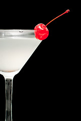 Image showing cocktail in martini glass with red cherry closeup