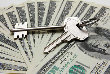 Image showing keys on stack of hundred-dollar bills