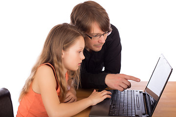 Image showing Father and daughter working on a laptop