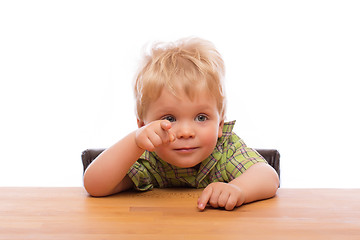 Image showing Little child pointing finger to someone