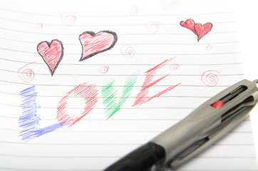 Image showing Love Written in Notebook With a Pen.