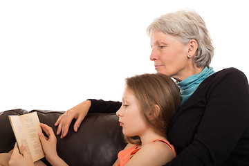 Image showing Grandmother read a book with her granddaughter