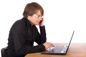 Image showing Business man working on a laptop