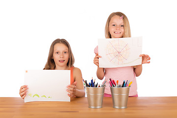 Image showing Young girls show their drawings