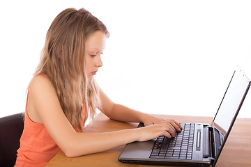 Image showing Young girl working on a laptop