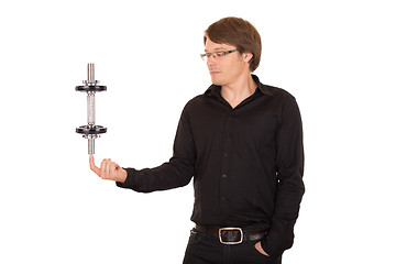 Image showing Business man juggling with dumbbell