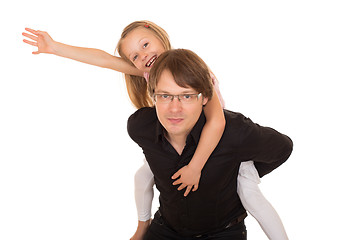 Image showing Man giving piggyback ride to a little girl