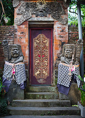 Image showing Gates of the old temple with stone guards. Indonesia, Bali.