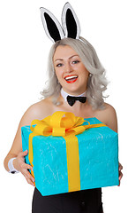 Image showing Laughing blonde woman with rabbit ears and a gift