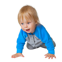 Image showing Inquisitive child crawling on the floor