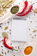 Image showing Spices, notebook, red chili pepper