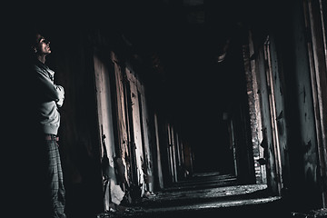 Image showing dark corridor and the man in a gloom
