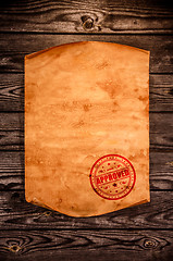 Image showing Blank old paper against the background of an aged wood