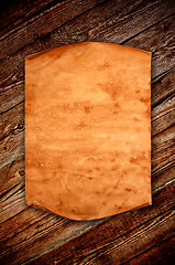 Image showing Blank old paper against the background of an aged wood