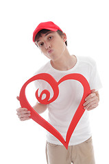 Image showing Teenager holding red love heart kiss