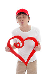 Image showing Teen boy red heart puckering up kissing 