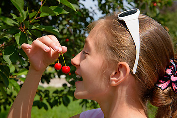 Image showing Girl and cherry