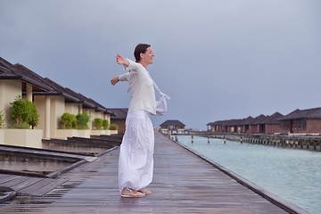 Image showing young woman relax on cloudy summer day