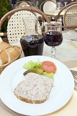 Image showing French food pate terrine of rabbit with red wine in cafe photogr