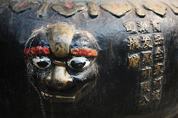 Image showing Close-up of a face sculpture at a temple in China