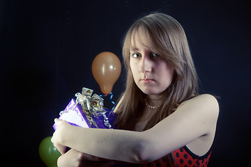 Image showing sad girl with a gift box