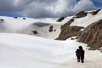 Image showing Two hikers on snow plateau