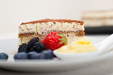 Image showing tiramisu dessert with berries and cream