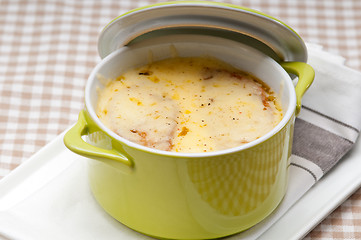 Image showing onion soup with melted cheese and bread on top