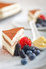 Image showing tiramisu dessert with berries and cream