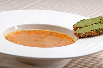 Image showing Italian minestrone soup with pesto crostini on side