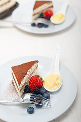 Image showing tiramisu dessert with berries and cream