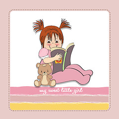 Image showing sweet little girl reading a book