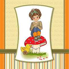 Image showing pretty young girl sitting on a mushroom