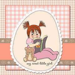 Image showing sweet little girl reading a book