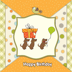 Image showing three dogs that offer a big gift. birthday greeting card