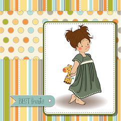 Image showing young girl going to bed with her favorite toy, a giraffe