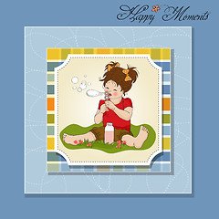 Image showing funny lovely little girl blowing soap bubbles