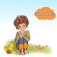 Image showing curly girl play with her duck toy