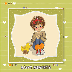 Image showing curly girl play with her duck toy