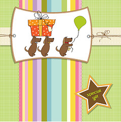 Image showing three dogs that offer a big gift. birthday greeting card