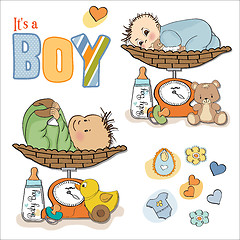 Image showing baby boy weighed on the scale, items set on white background