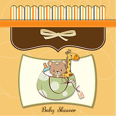 Image showing new baby announcement card with bag and same toys