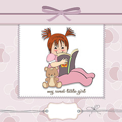 Image showing sweet little girl reading a book