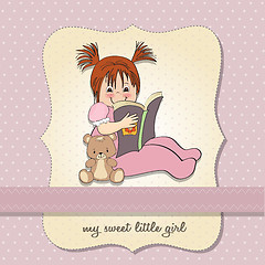 Image showing sweet little girl reading a book